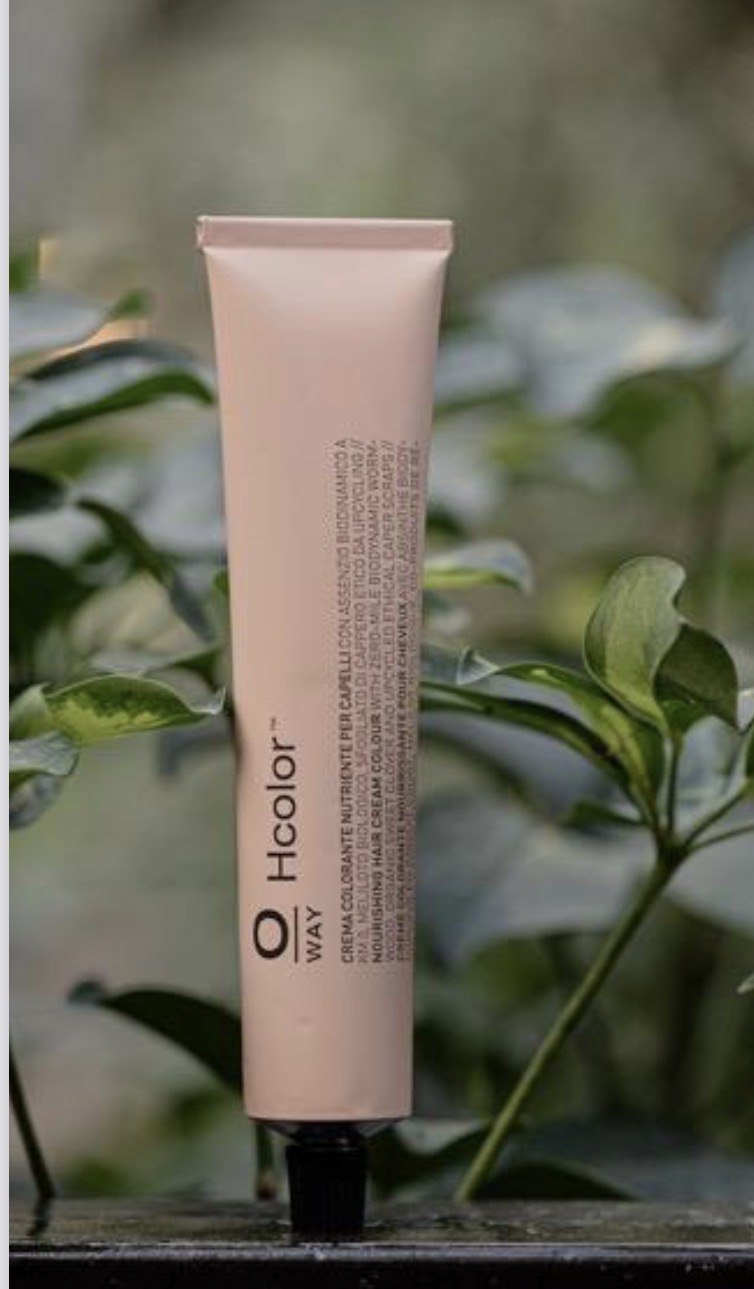 OWAY hair-care product among green leaves